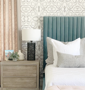wallpaper accent wall behind bed, aqua blue velvet headboard, beige trimmed drapes, arizona bedroom design